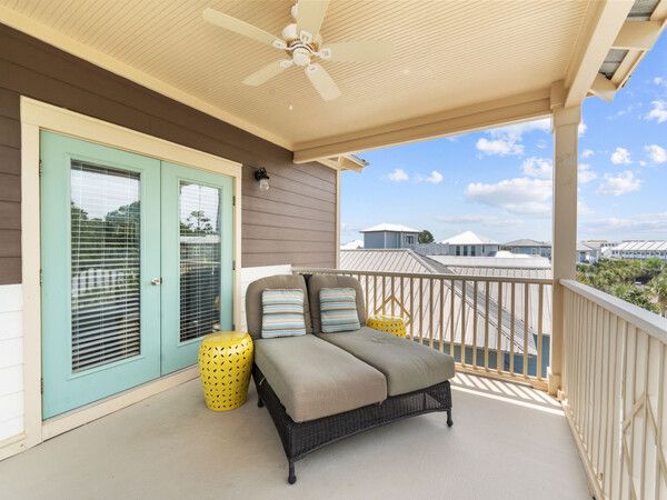 Palm-lined roundabout at Seacrest Beach with coastal homes in the background.