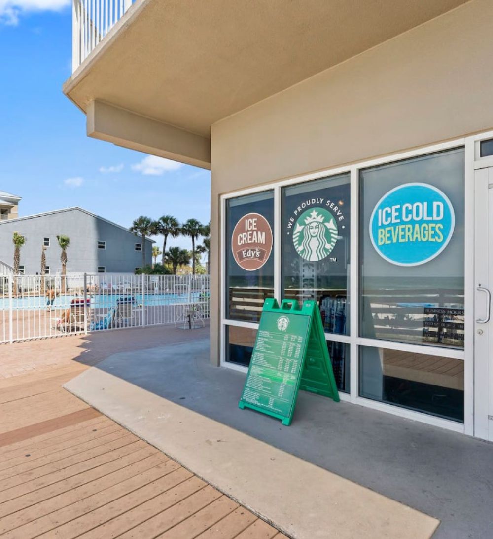 Flip Flops Corner Market at Tidewater Beach Resort offering snacks, beverages, and Starbucks coffee, located next to the pool deck.