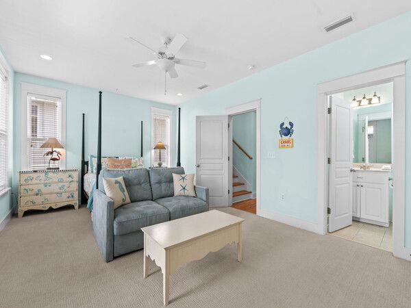 Large second-floor bedroom suite with sitting area and ensuite bathroom in Seacrest Beach rental.
