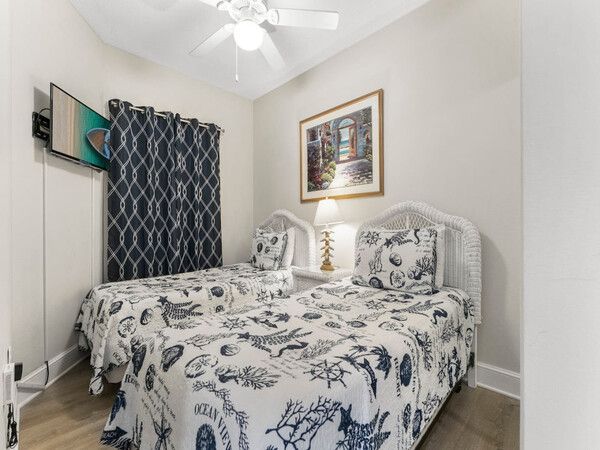 Lagoon-style outdoor pool at Majestic Beach Resort surrounded by palm trees and sun loungers.