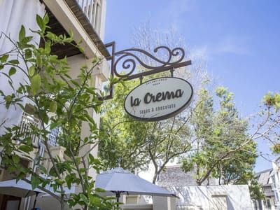 Scenic stretch of the Timpoochee Trail bike path running along coastal lakes and Highway 30A.