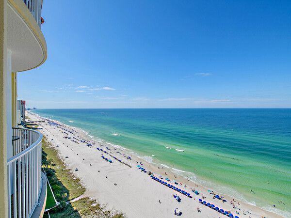 Stunning Gulf Coast beach and emerald waters viewed from a private high-rise balcony at Ocean Ritz.