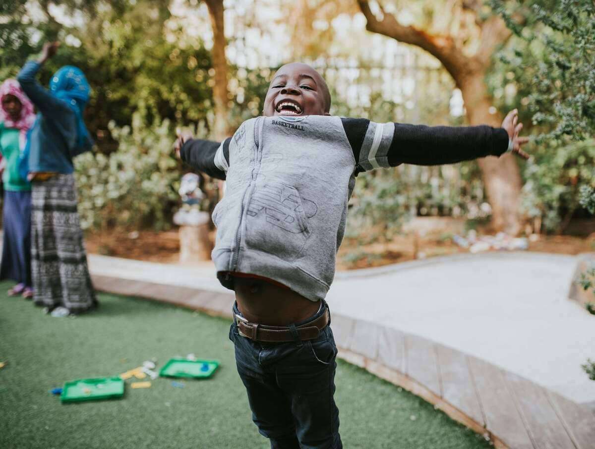 smiling boy at the mini-golf 