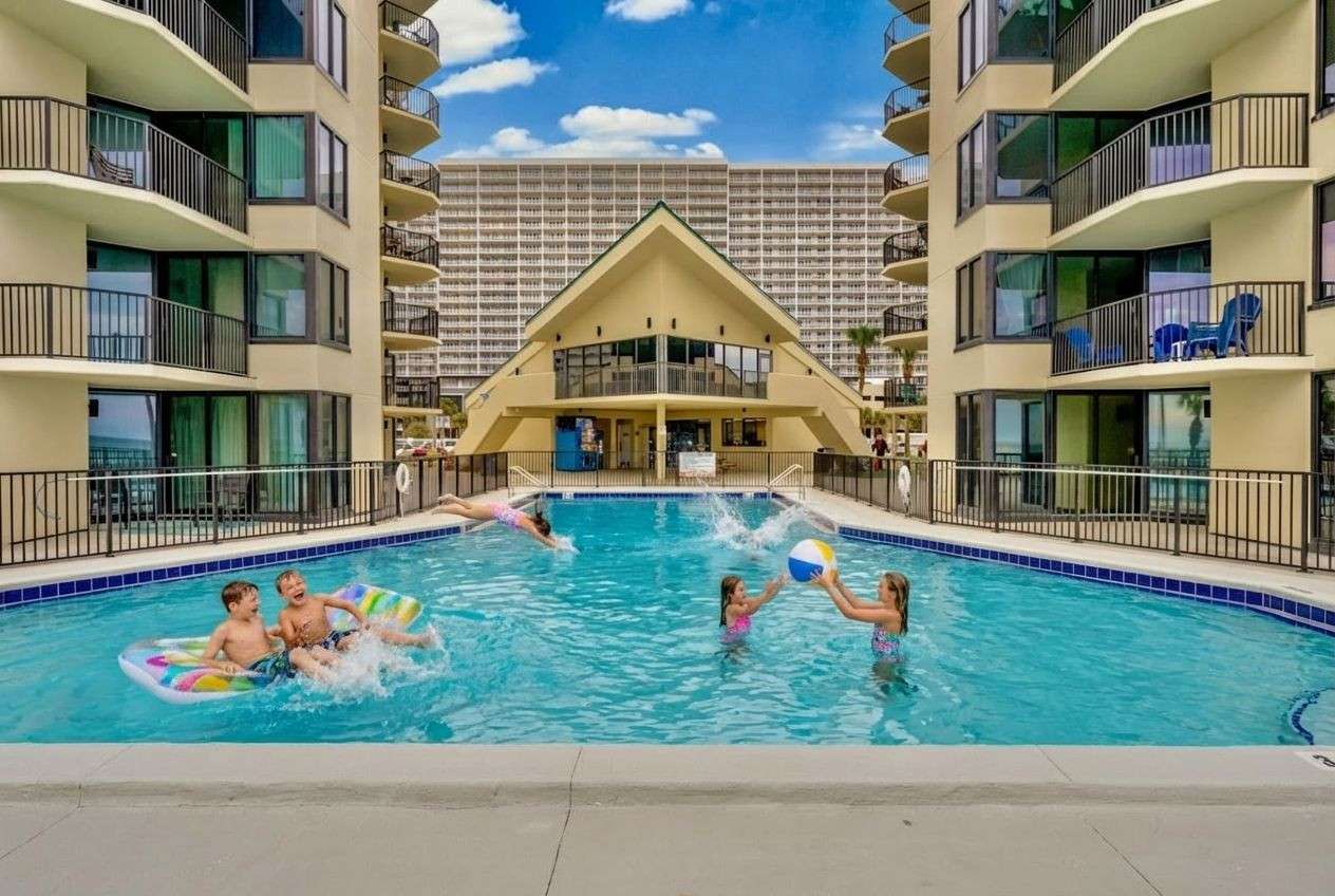 Children playing at the swimming pool at Sunbird Beach Resort